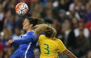 United State's Carli Lloyd (10) goes up for a header with Brazil's Monica (3) as the U.S. Women's National Soccer team play Brazil in a friendly, which is part of the U.S. team's victory tour following their World Cup win this summer, at CenturyLink Field, Wednesday, October 21, 2015, in Seattle, Wash. Brazil leads the half, 1-0.